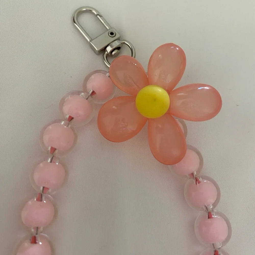 1-wrist lanyard for cells, keys and more Pink Oversized Flower Charm